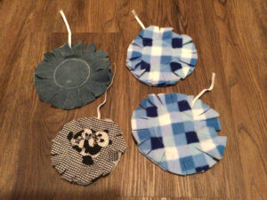 Metal lids sandwiched in fabric